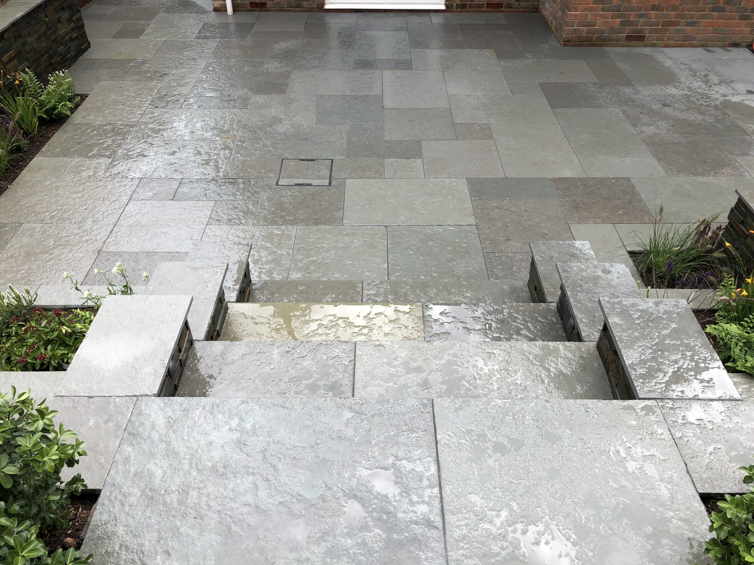 Finished landscaped patio with stone paving
