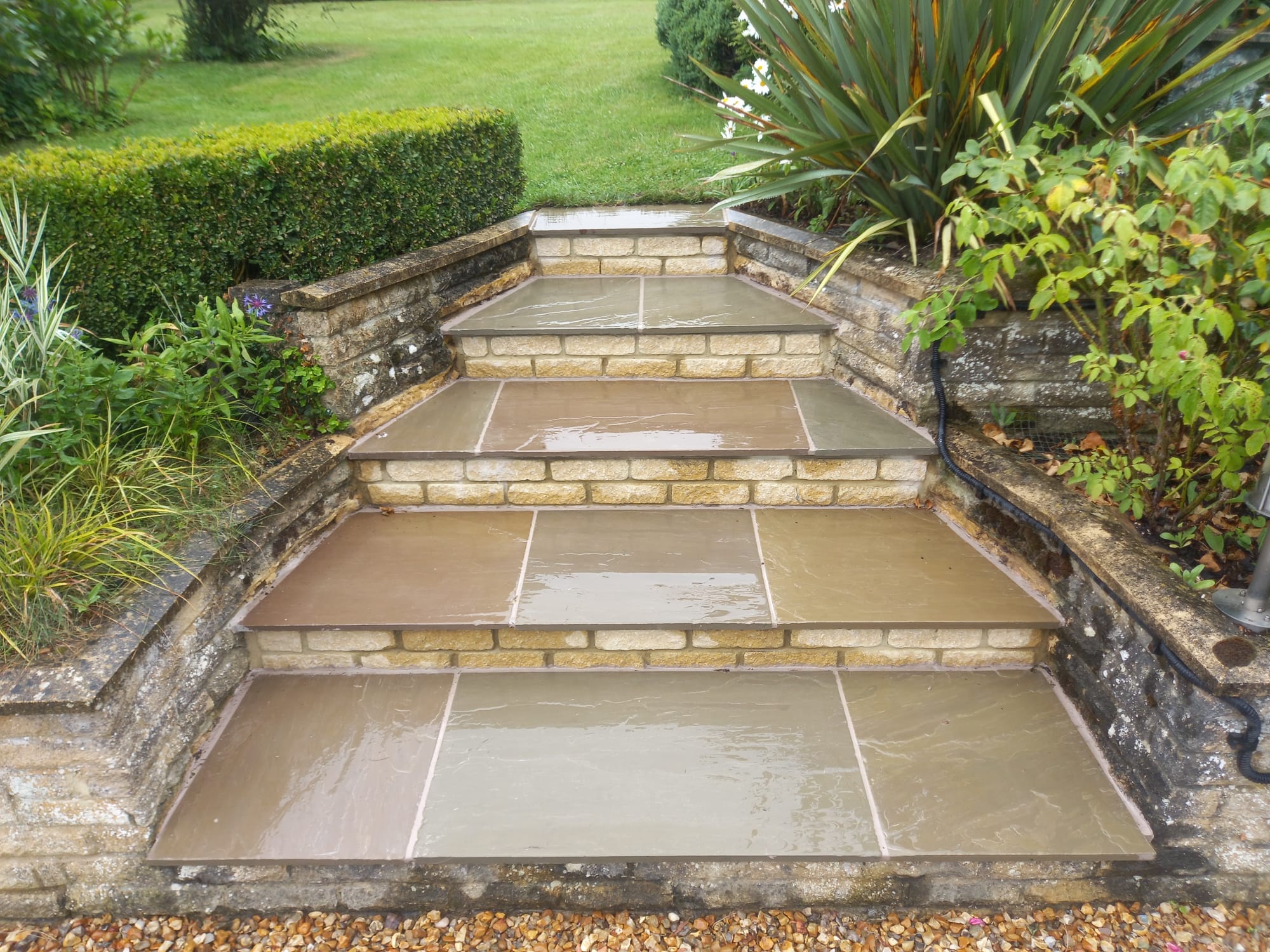 Garden steps finished with natural stone paving